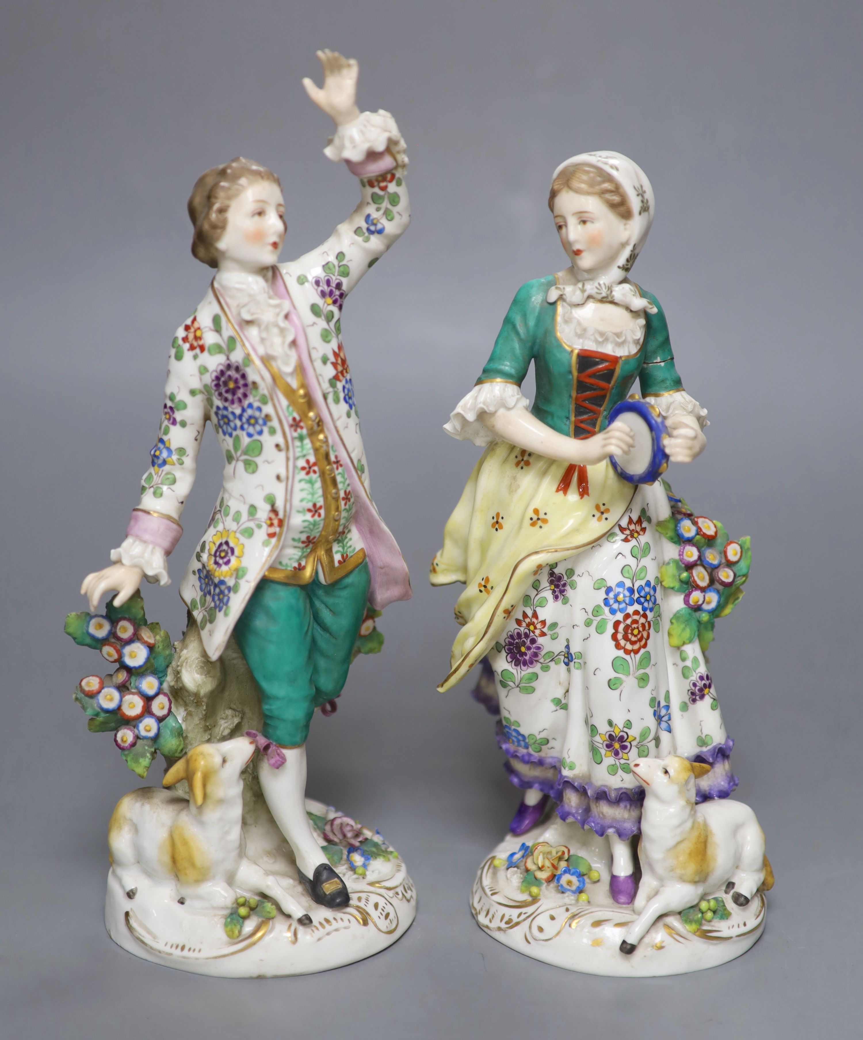 A pair of Continental figurines, height 27cm